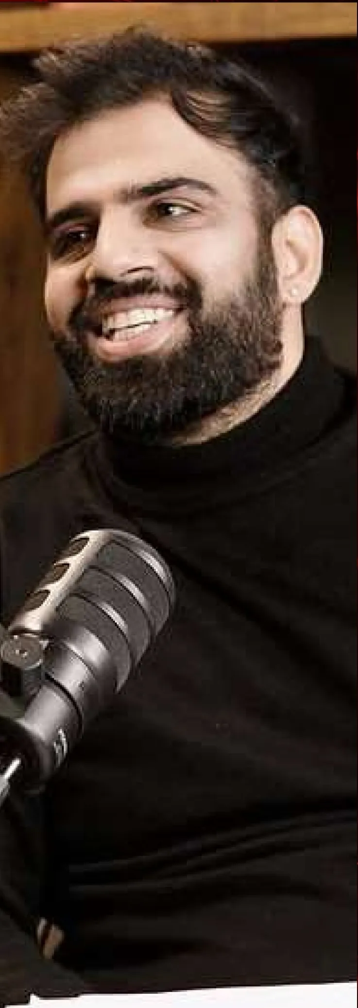 Sahil Jasuja, host of The Founder's Paradox, at the podcast microphone
